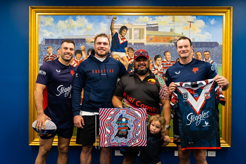 Celebrating Heritage: (L to R) James Tedesco, Angus Crichton, Jason Ridgeway and Boyd Cordner show off the 2021 Indigenous Jersey and the original artwork. 