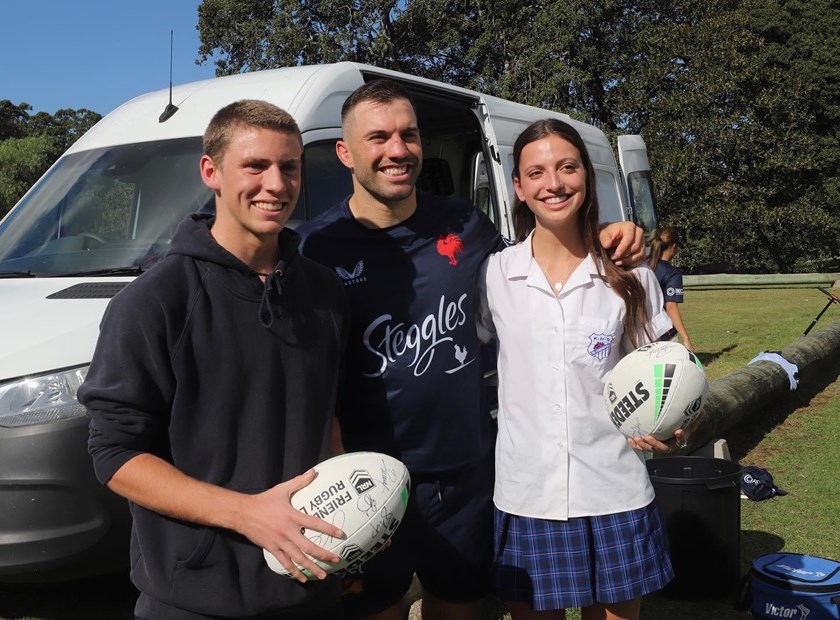 Evie Smith (right) meets Sydney Roosters Captain James Tedesco.
