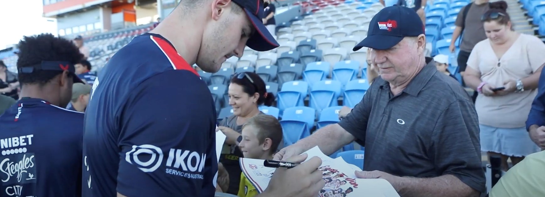 Fan Day: Member Duncan Marshall had the opportunity to spend time with his son-in-law and grandsons at the Club's Open Training Session in Mackay. Fletcher Baker signs his autograph for his team poster. 
