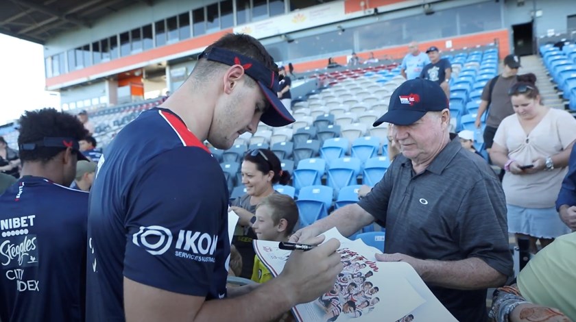Fan Day: Member Duncan Marshall had the opportunity to spend time with his son-in-law and grandsons at the Club's Open Training Session in Mackay. Fletcher Baker signs his autograph for his team poster. 