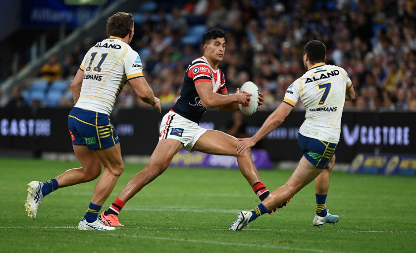 Suaalii produces his first of many thrilling plays, putting a massive step on Mitchell Moses to open a hole in the Eels' defensive line. 