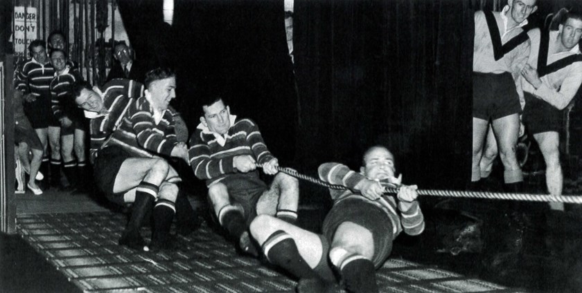 Clubman: A promotional event in typical 1947 style, with Dick Dunn (front) leading an Easts team in a tug of war competition at the Capitol Theatre. 