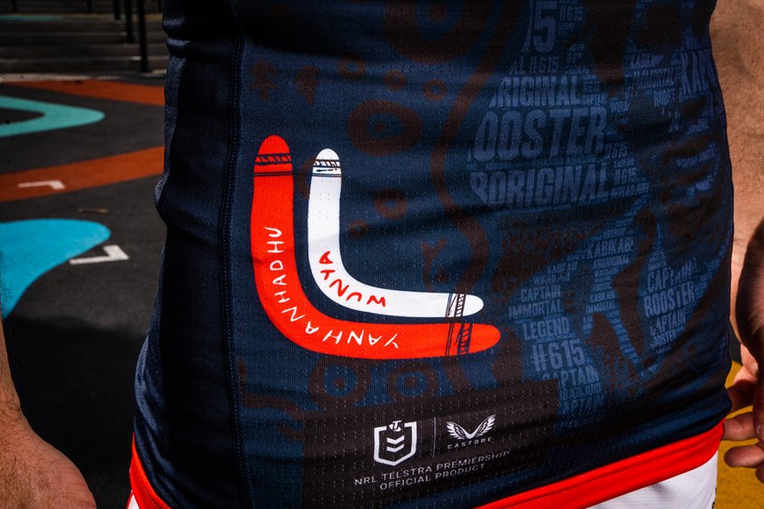 The bottom left corner of the jersey features boomerangs with the words hello and goodbye in  Kabi Kabi and Wiradjuri language alongside the symbol of a dolphin.