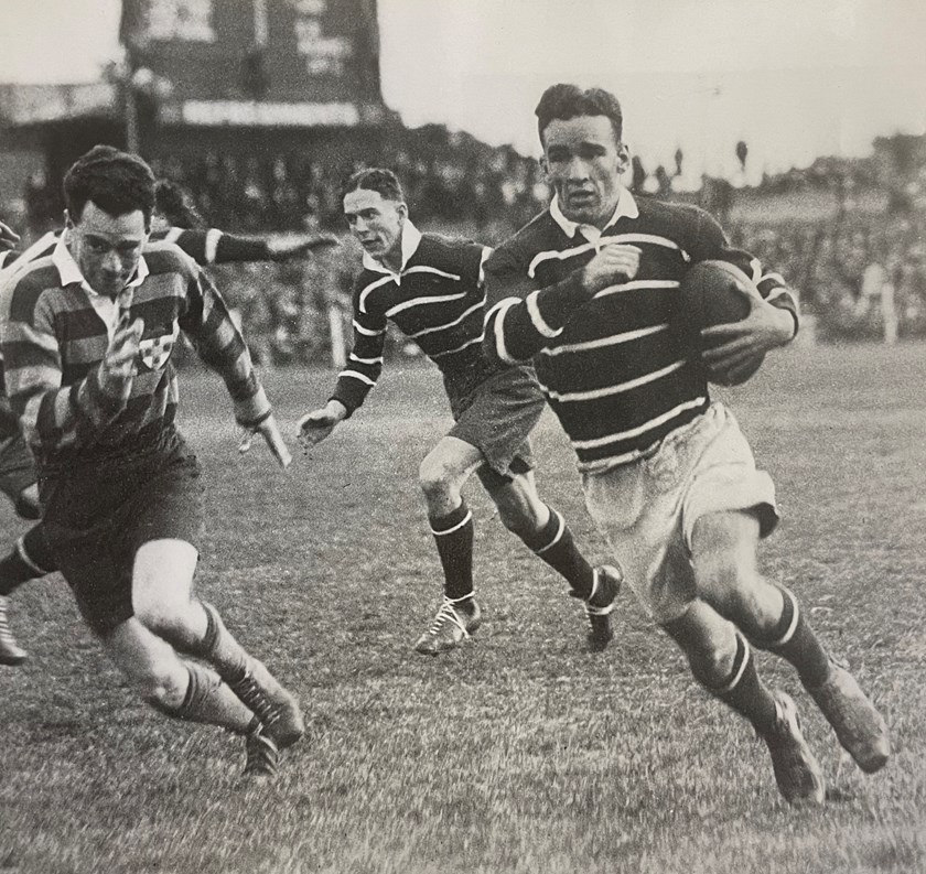 Runaway: Fleet-footed centre Jack Lynch gets away in a match against University during the 1936 season. 