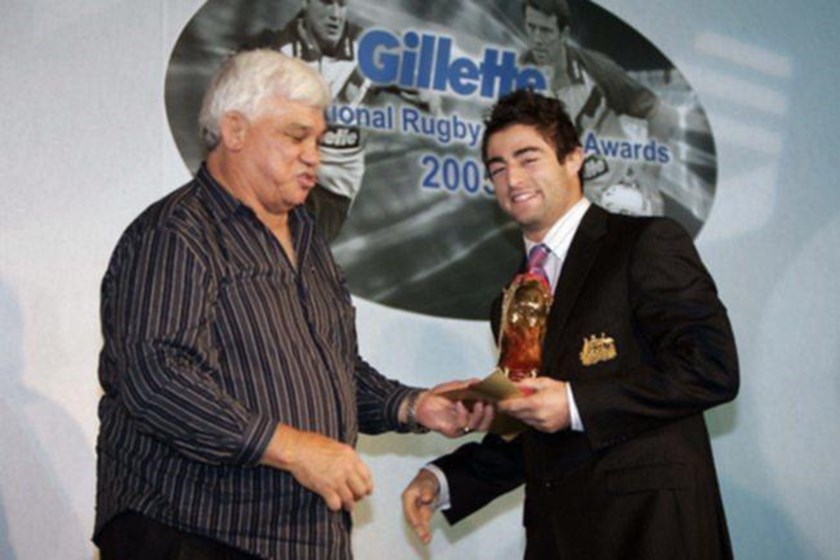 Best in the World: Golden Boot recipient Anthony Minichiello receives his award in 2005, appropriately by the man who helped to bring him to the Roosters - the legendary Arthur Beetson.