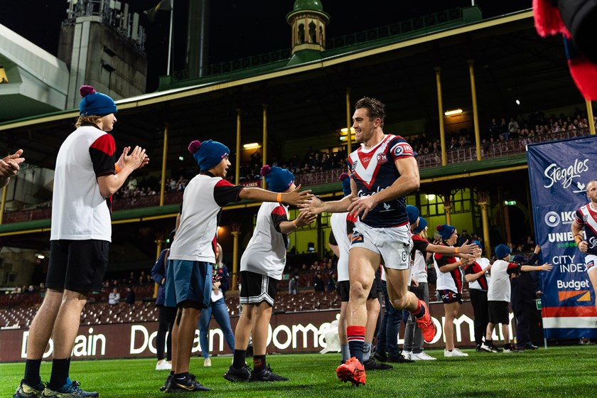 Cheering on their Heroes: Students who completed the Bush to Posts program were rewarded with a trip to the SCG, and formed a guard of honour for Roosters players as they ran out onto the field.