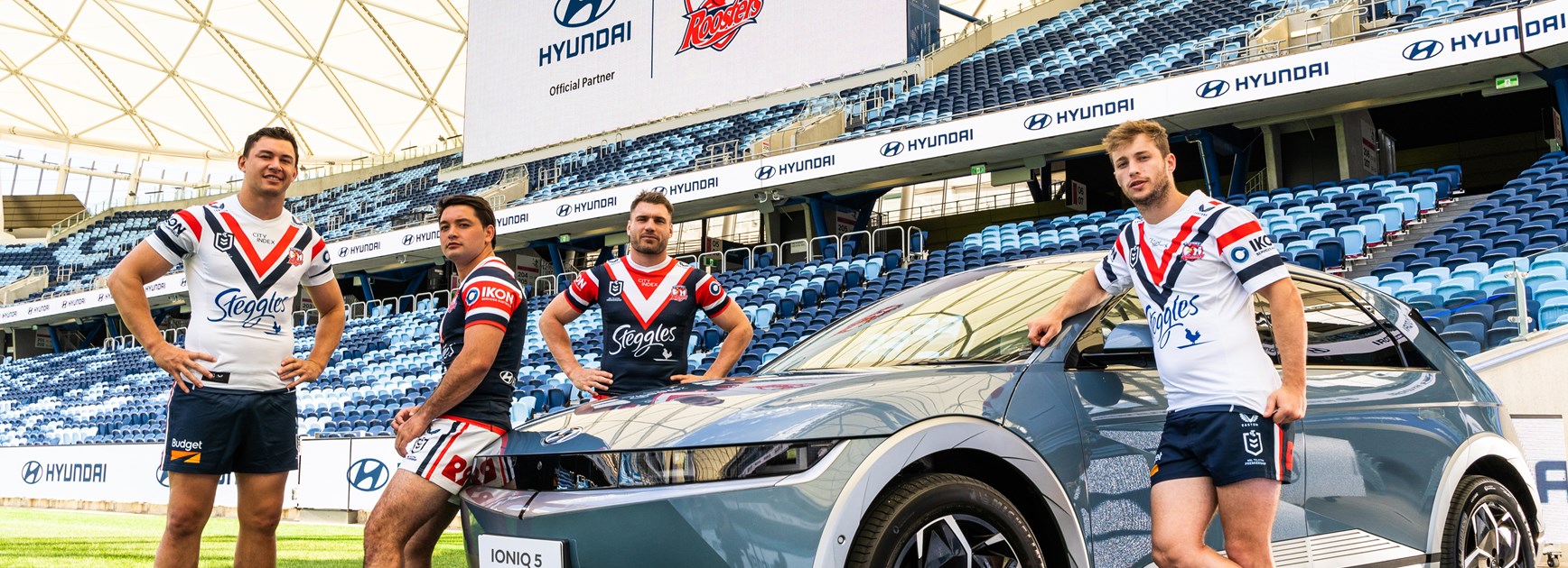 A Great Partnership: Joseph Manu, Brandon Smith, Angus Crichton & Sam Walker pose with the Hyundai IONIQ 5 at Allianz Stadium.