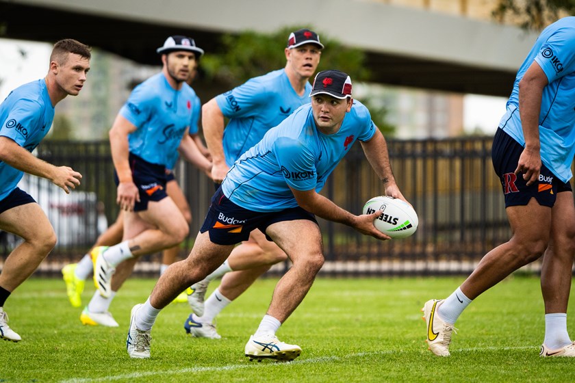 Dialled In: Brandon Smith jumps out of dummy-half during an intense ball-work session.