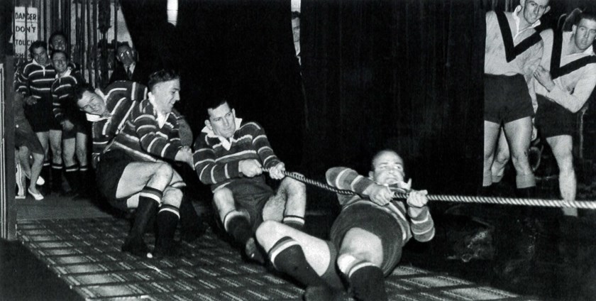Clubman: A promotional event in typical 1947 style, with Dick Dunn (front) leading an Easts team in a tug of war competition at the Capitol Theatre.
