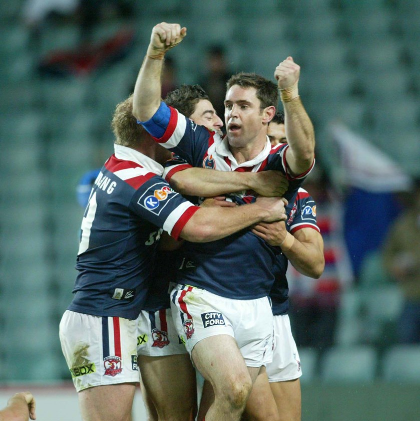 Proud as Punch: Roosters captain Brad Fittler celebrates the late-season win against the Panthers in 2004. 