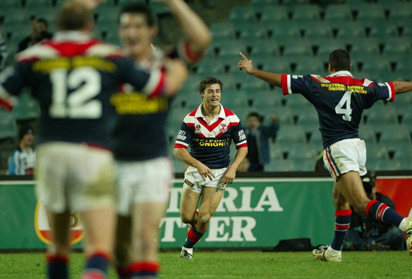 We're In!: Anthony Minichiello and teammates celebrate the victory over the Sharks in the 2002 Qualifying Final. 