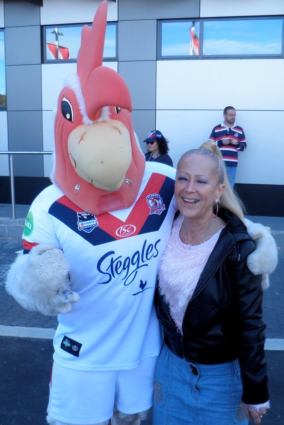 Five Decades Strong: Annie Potter pictured here outside the old Sydney Football Stadium with Rocky the Rooster. 