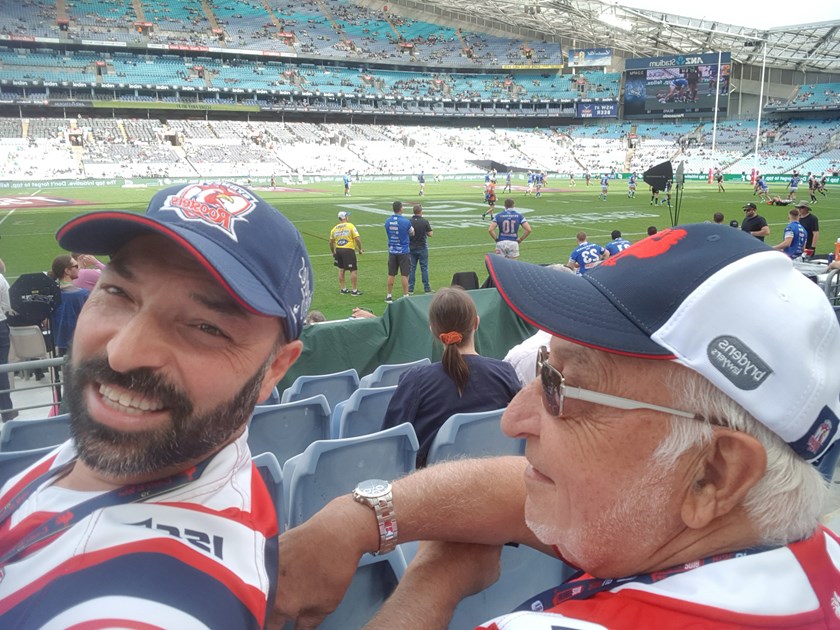 Family Ties: Ten-Year Bronze Member Steve Tikellis with his father at the 2019 Grand Final, just four rows away from the action. 