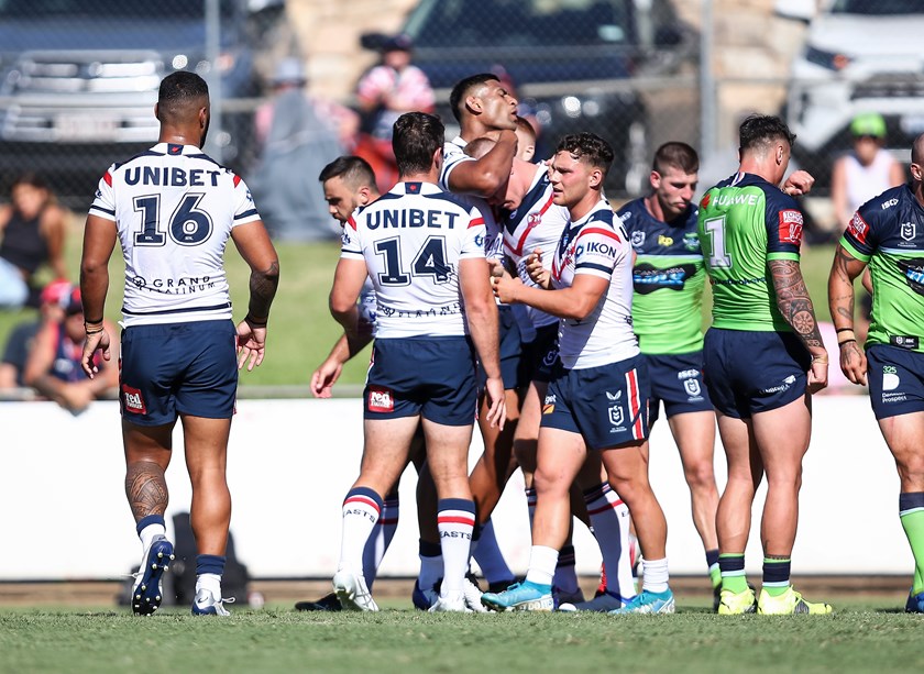 Congrats: Lindsay Collins is embraced by teammates as he scored a barnstorming try. 
