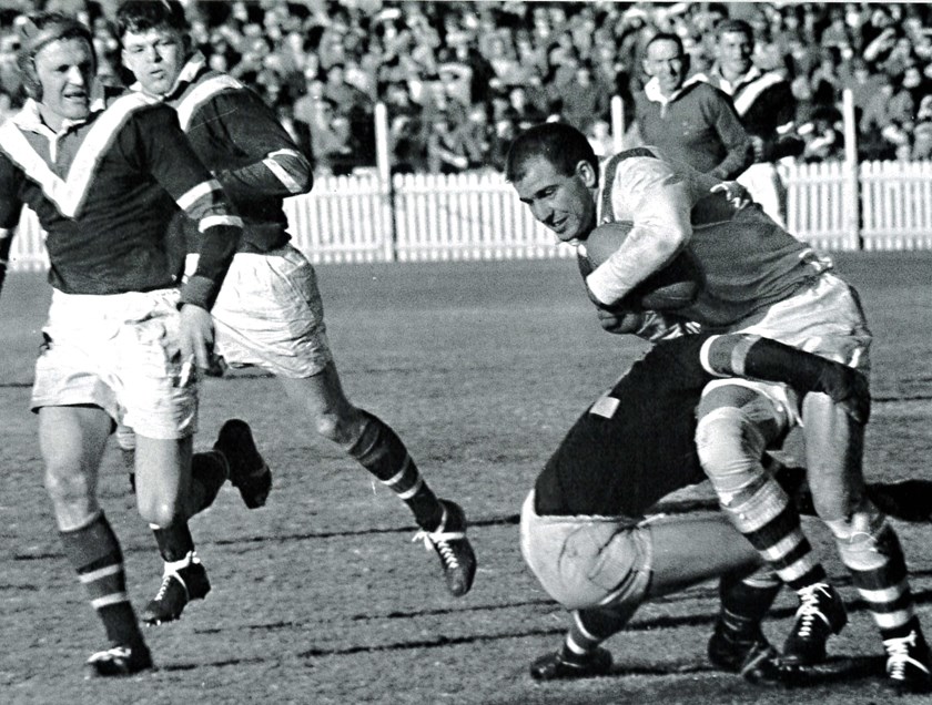 Big Hits: A memorable 12-5 victory in 1961 against the formidable St George side. Doug Ricketson tackles front rower Monty Porter at the SCG, with teammates Dick See (headgear) and Bob McDonagh keeping an eye on their centre. 