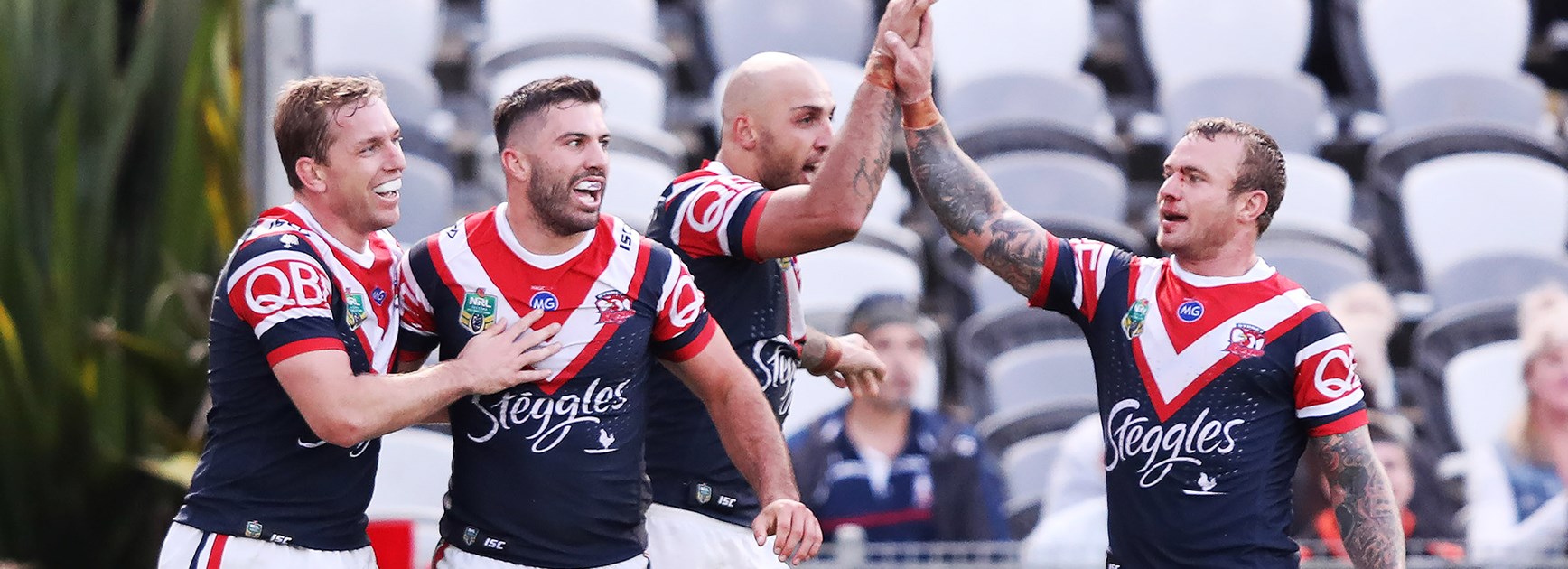 Second-half blitz helps Roosters swamp Titans