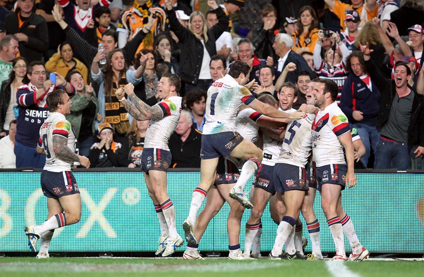 The Roosters celebrate the game of the decade after Shaun Kenny-Dowall snatches the Qualifying Final against the Wests Tigers.