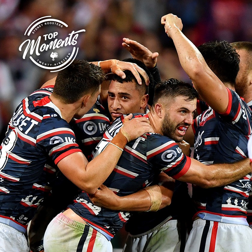 The Roosters rush to congratulate Siosiua Taukeiaho after he seals the ANZAC Day match with a memorable try.