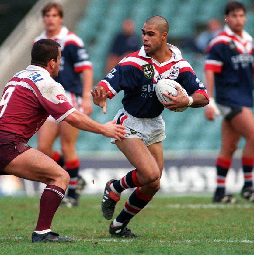 Sydney Roosters player Matt Sing fends Sea Eagles player in Round 10, 1998