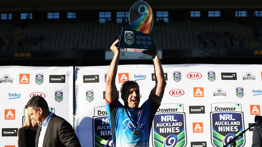 Mitchell Aubusson raises the NRL Auckland Nines trophy after the Club's 2017 win.