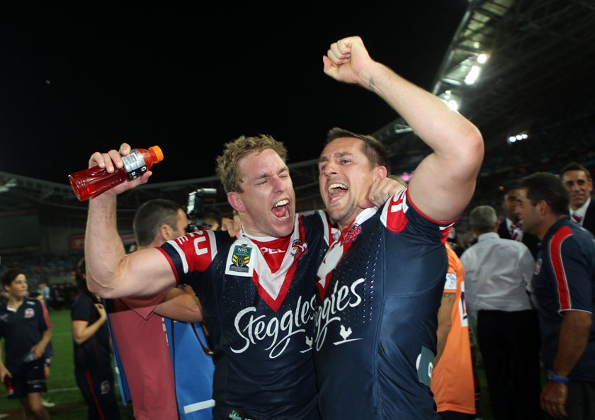 Aubusson celebrates the 2013 Premiership victory with Mitchell Pearce
