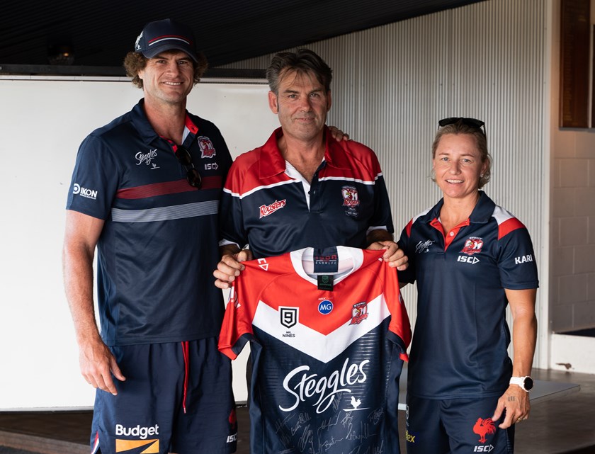 Sydney Roosters Nines Coaches Matt King and Kylie Hilder present a signed Roosters jersey to the Fremantle Roosters