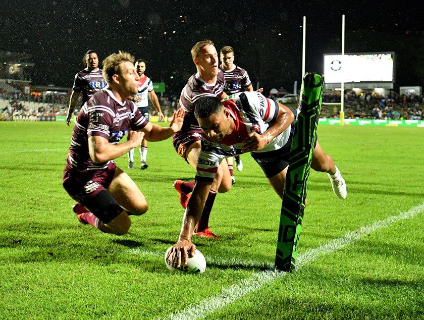 Daniel Tupou scores his first of the night against the Sea Eagles.