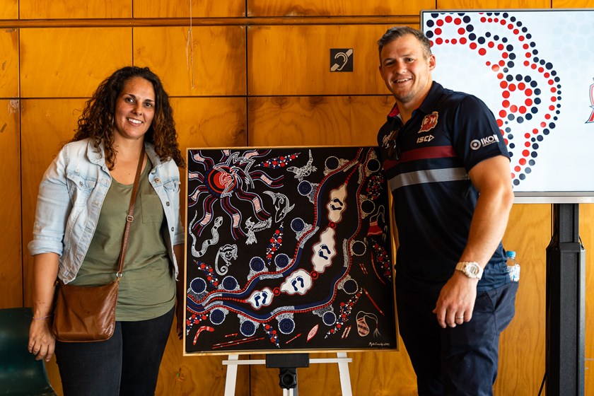 Artist Kylie Cassidy reveals her design with Roosters Winger Brett Morris at the Sydney Roosters Reconciliation Action Plan Launch